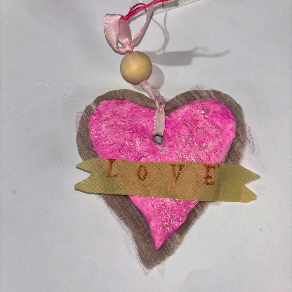 Handmade sparkly Valentine’s Day pink heart LOVE banner papier-mâché ornament.